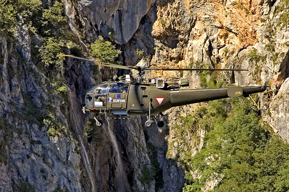 EUFOR's Alouette III operating in a mountain range