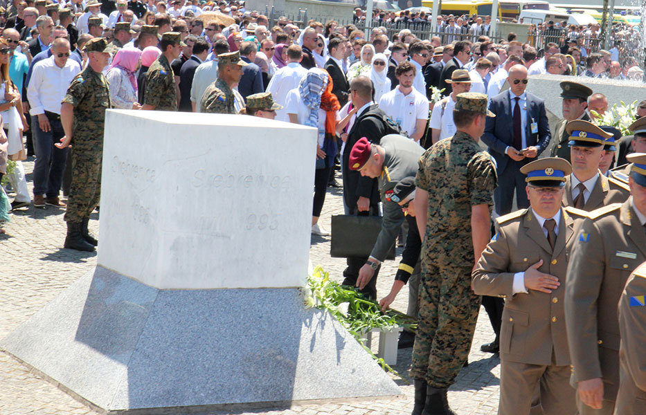 Major General Friedrich SCHROTTER and Brigadier General Giselle WILZ pay their respects at the Potocari Memorial Stone.